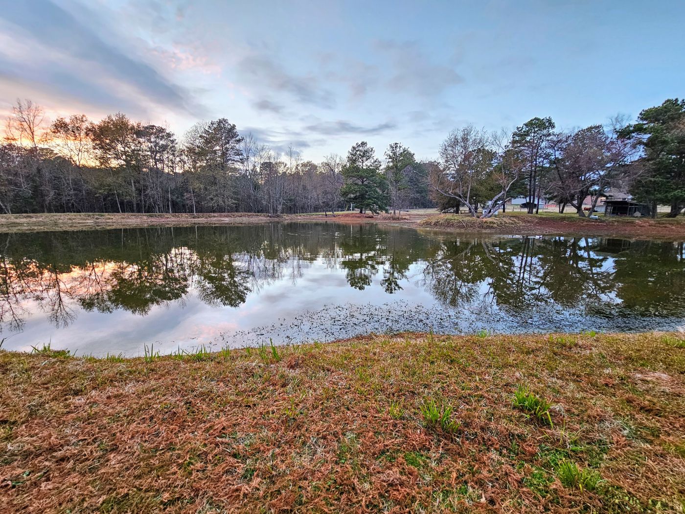 Sunset reflected in the fishing pond at Marshall RV Park