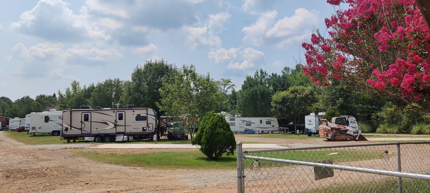 RV sites and open lawn on a summer day